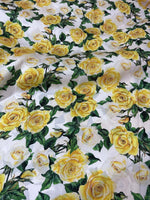 Yellow floral rose pattern fabric with green leaves on white background, 150cm wide for sewing and crafting projects