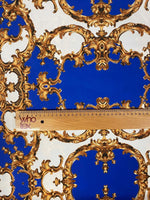 Royal blue fabric with intricate golden baroque pattern and measuring ruler for scale