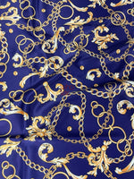 royal blue fabric with gold chains and baroque scroll patterns