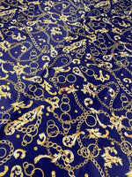 Royal blue fabric with gold chains and baroque scrolls pattern