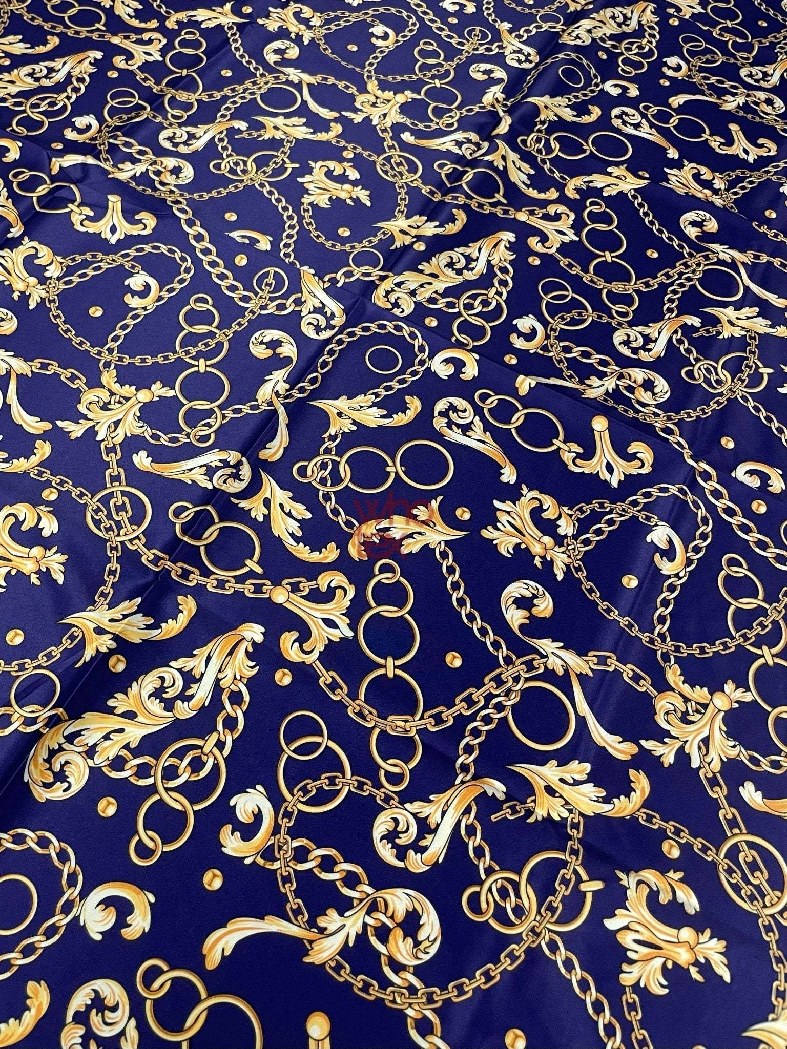 Royal blue fabric with gold chains and baroque scrolls pattern