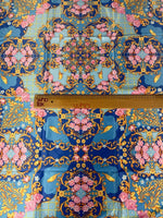 Royal blue ornate fabric with pink roses, birds, and gold scroll patterns