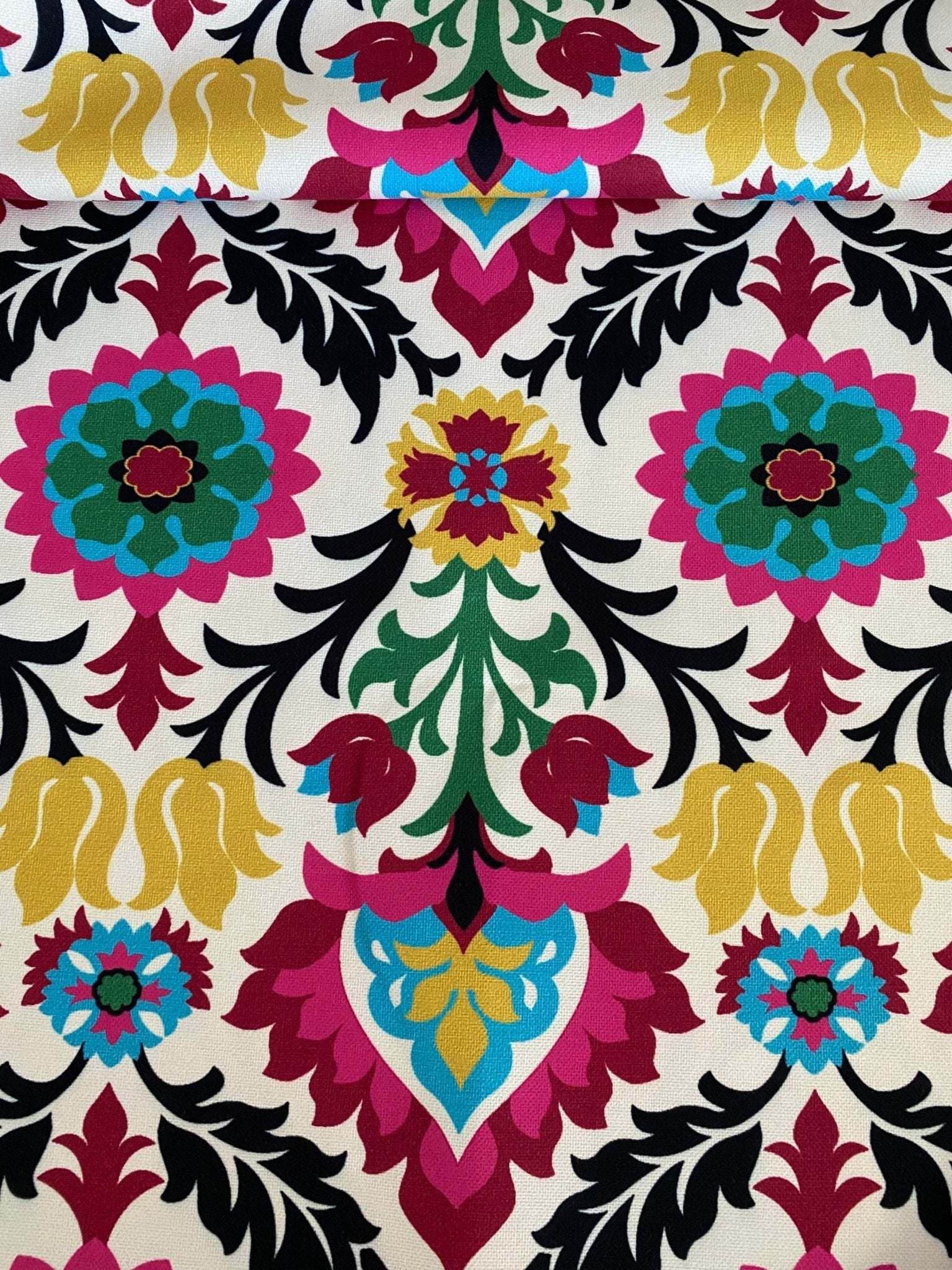 Santa Maria Outdoor Upholstery Fabric with colorful floral and leaf pattern, suitable for curtains, pillows, and bags.