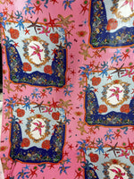 Coastal sea shell fabric with starfish and seashell patterns on pink background