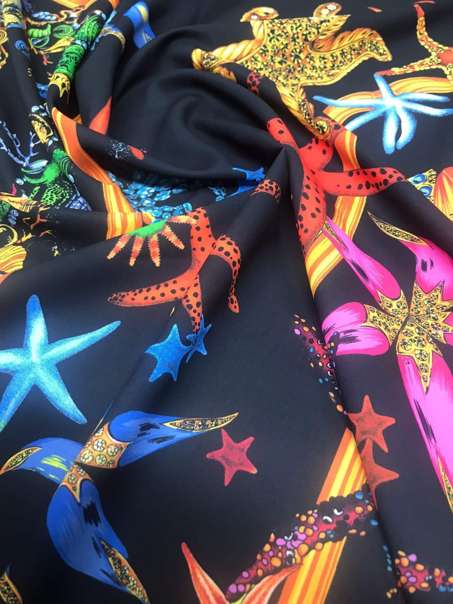 Black pink starfish and sea shell pattern fabric on black background