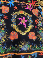 Black pink starfish and sea shell patterned fabric on black background