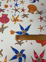 Sea Shell Fabric with colorful starfish and seashell prints on white background, fabric width 150cm.