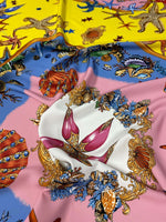 Sea Shells Starfish Fabric with colorful ocean-themed design featuring starfish, seashells, octopus, and coral on vibrant backgrounds