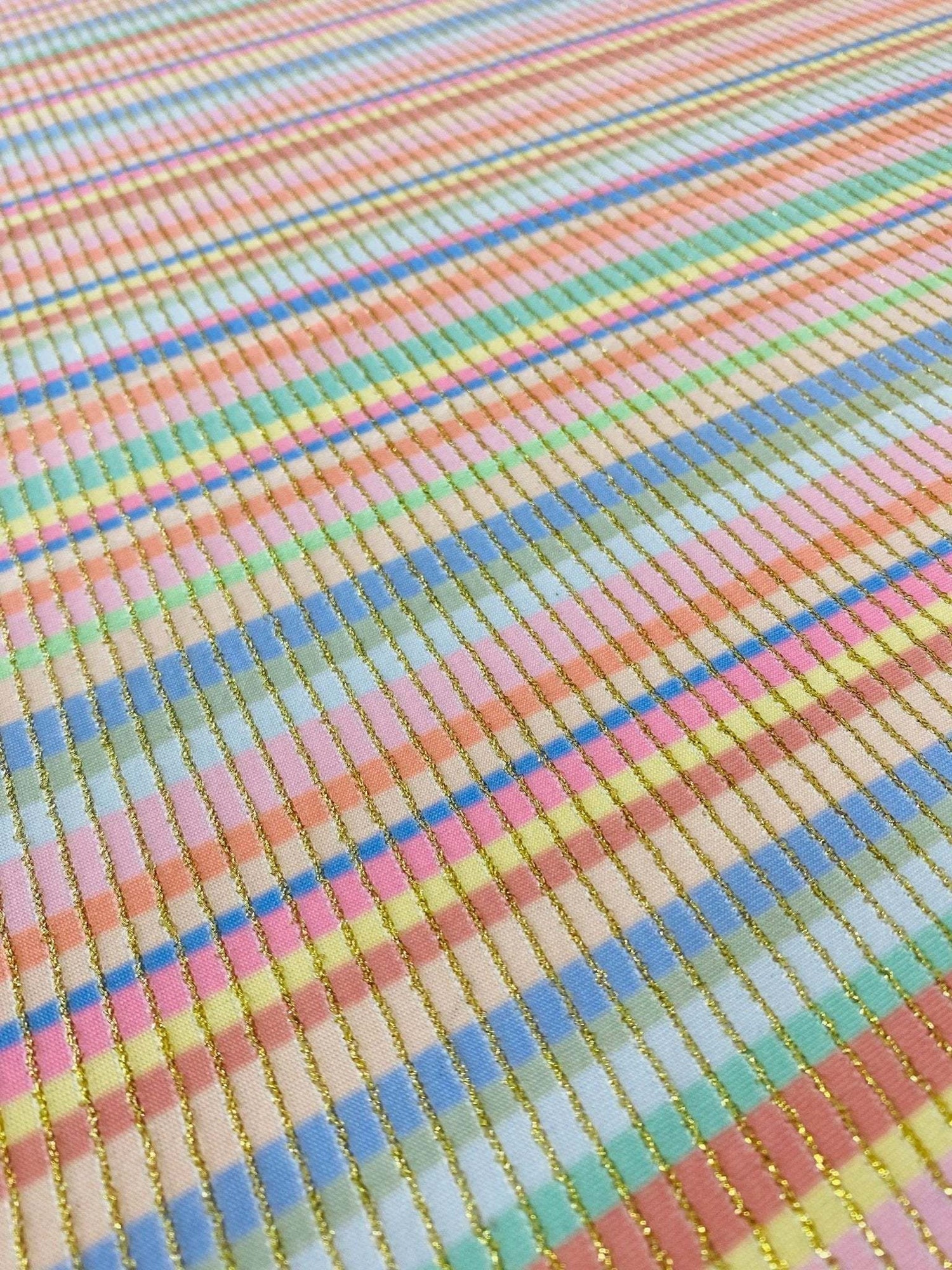 Soft Color Striped Shimmer Ottoman Fabric with pastel stripes and gold shimmer threads, 4-way stretch textile for activewear and costumes