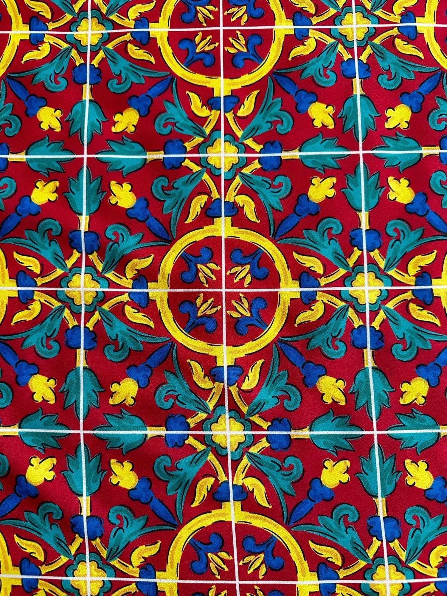 Sicilian Pattern Bordeaux fabric featuring intricate yellow, blue, and green floral and geometric designs on a rich bordeaux background.