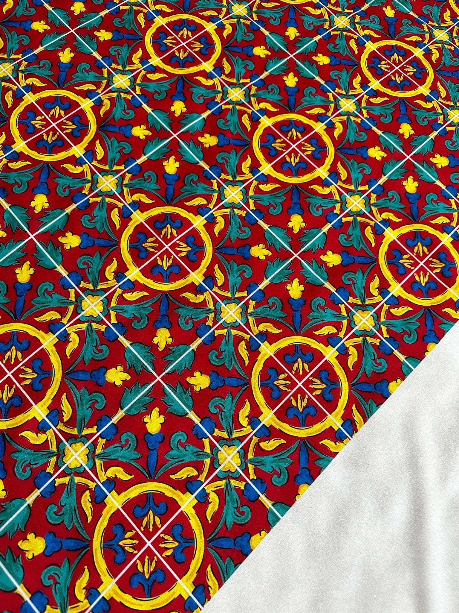 Sicilian Pattern Bordeaux Fabric with intricate yellow, green, and blue motifs on a rich bordeaux background, suitable for upholstery and drapery.