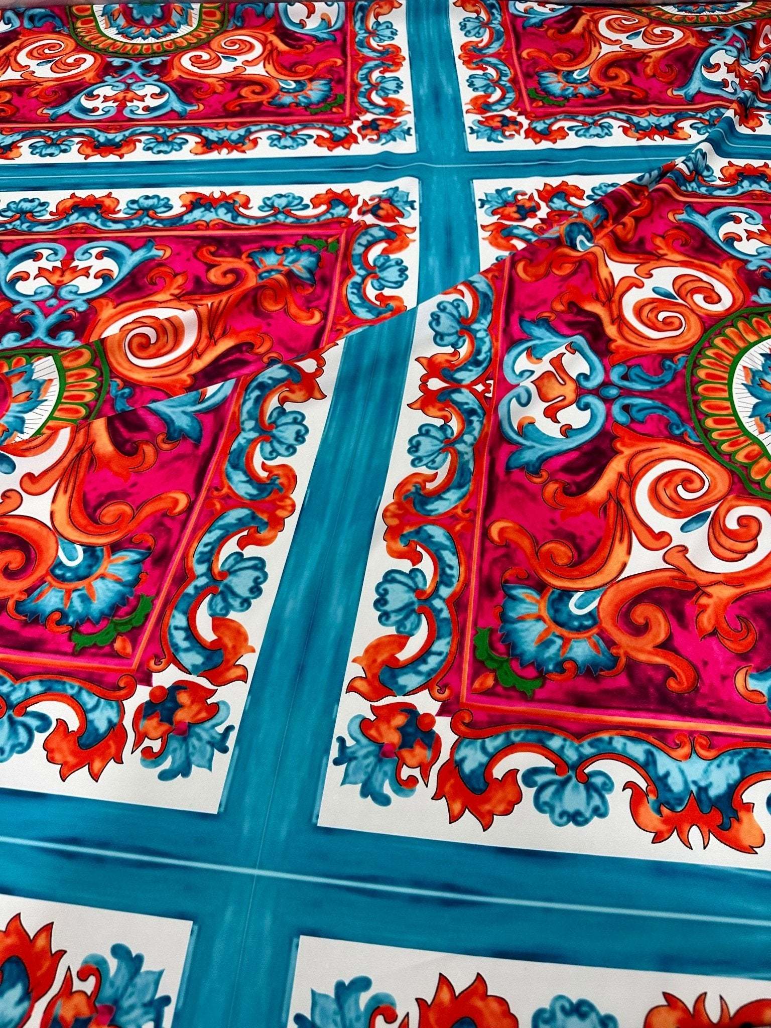Colorful Sicilian Caretto pattern fabric with vibrant red, blue, and orange ornate design on 150cm wide fabric for upholstery and crafts