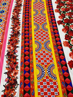 Sicilian floral fabric by the yard featuring vibrant red roses and intricate colorful geometric patterns on wide fabric panels