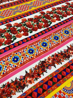 Vibrant Sicilian Floral Fabric by the yard featuring intricate red rose patterns and colorful geometric designs on a wide 150cm fabric.