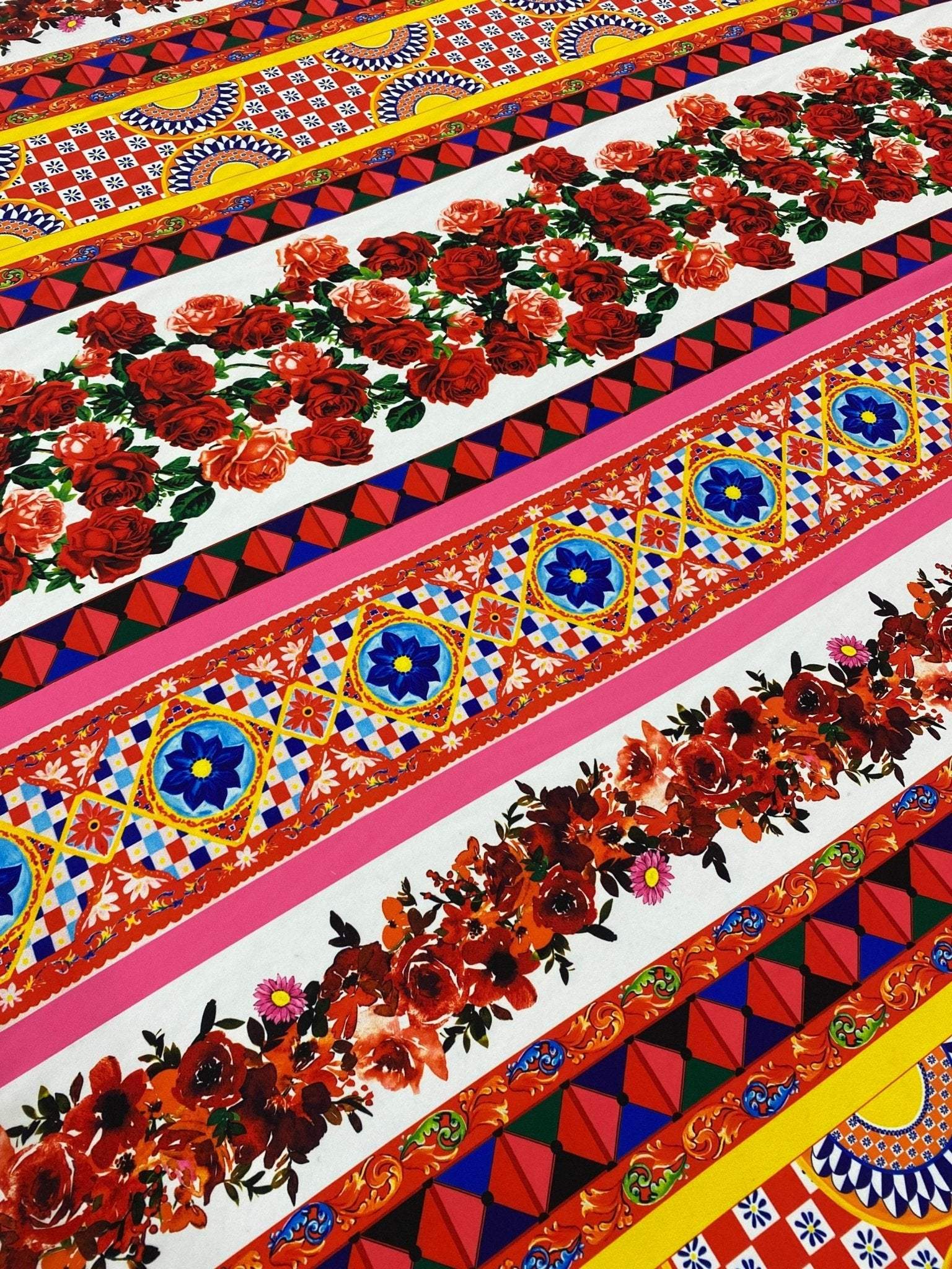 Vibrant Sicilian Floral Fabric by the yard featuring intricate red rose patterns and colorful geometric designs on a wide 150cm fabric.