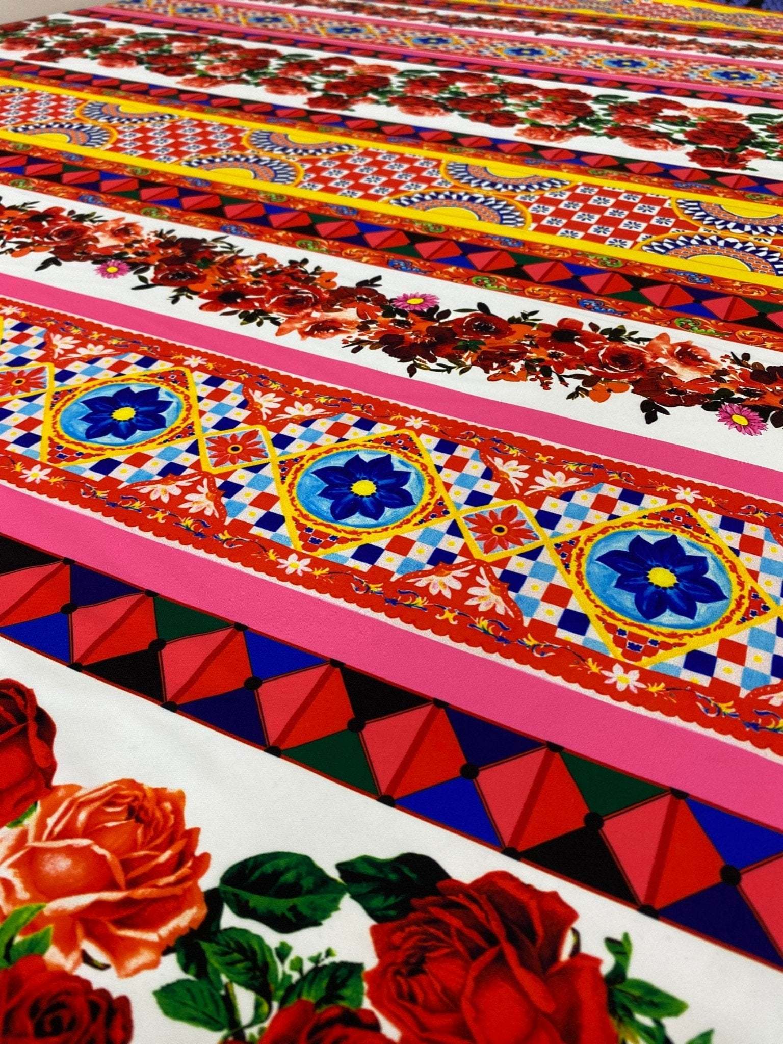 colorful Sicilian floral fabric with intricate patterns and vibrant red roses