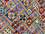 Sicilian Pattern Italian Fabric featuring vibrant, intricate geometric and floral designs in bold colors for fashion and home décor