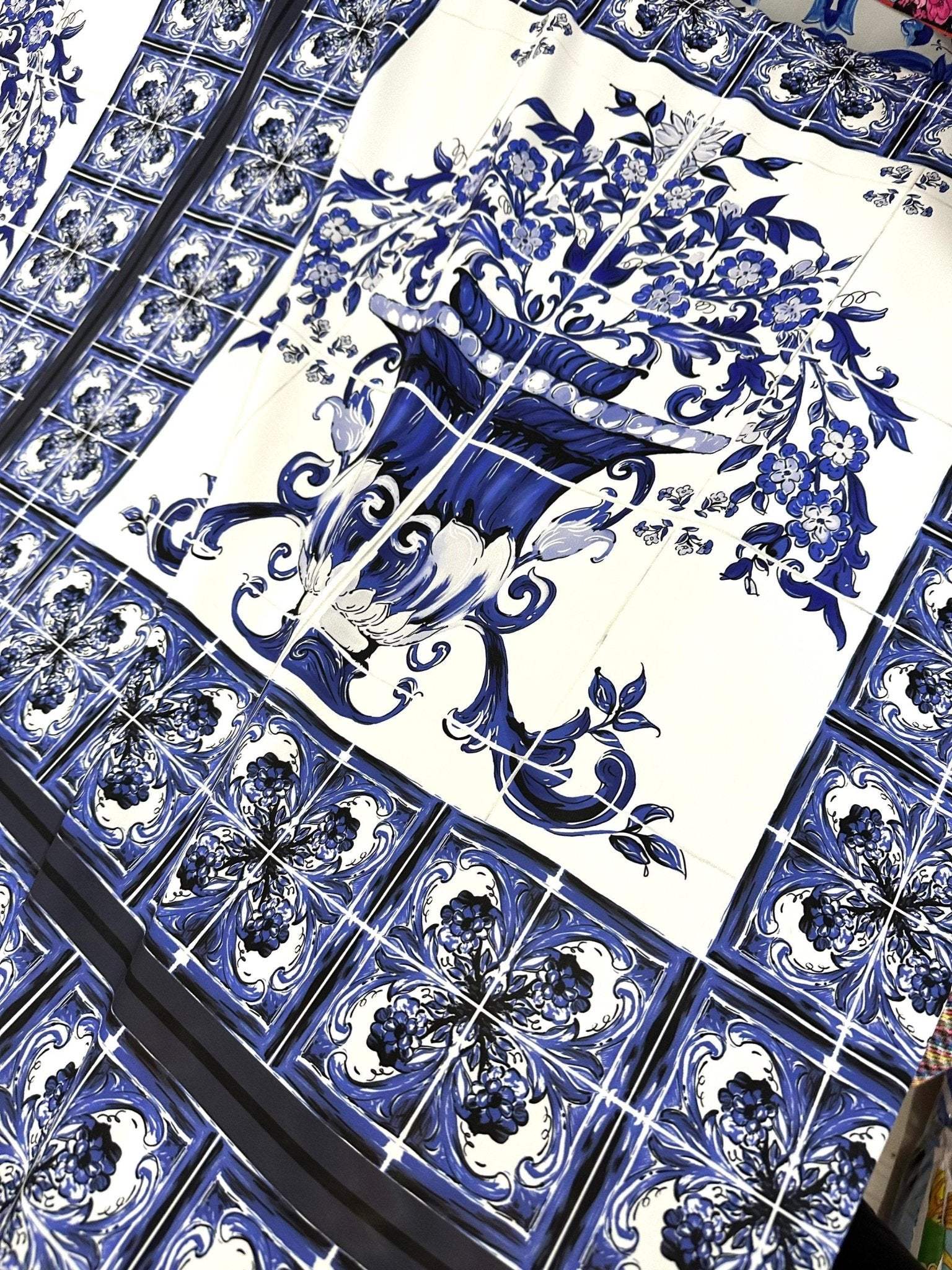 Majolica Floral Upholstery Fabric with intricate blue floral pattern and decorative motifs on white background, 150cm wide upholstery fabric