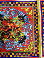 Vibrant Sicilian pattern fabric in red and blue with intricate floral and classical motifs, suitable for upholstery and home decor projects.