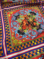 Vibrant red and blue Sicilian pattern fabric with intricate floral and cherub design, perfect for upholstery and decor projects