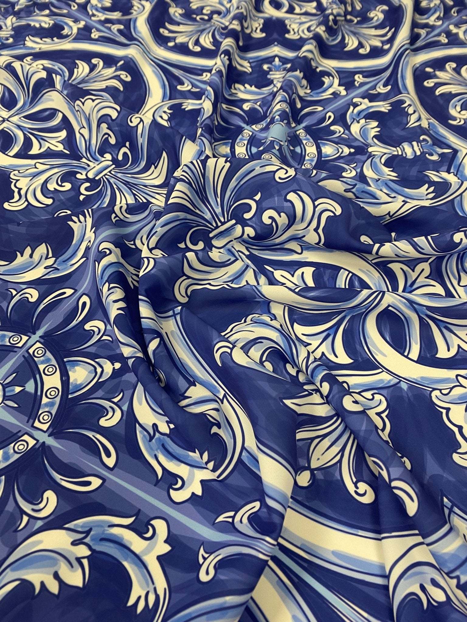 Blue and white Sicilian print fabric with intricate traditional floral and ornamental patterns, soft texture and 150cm width