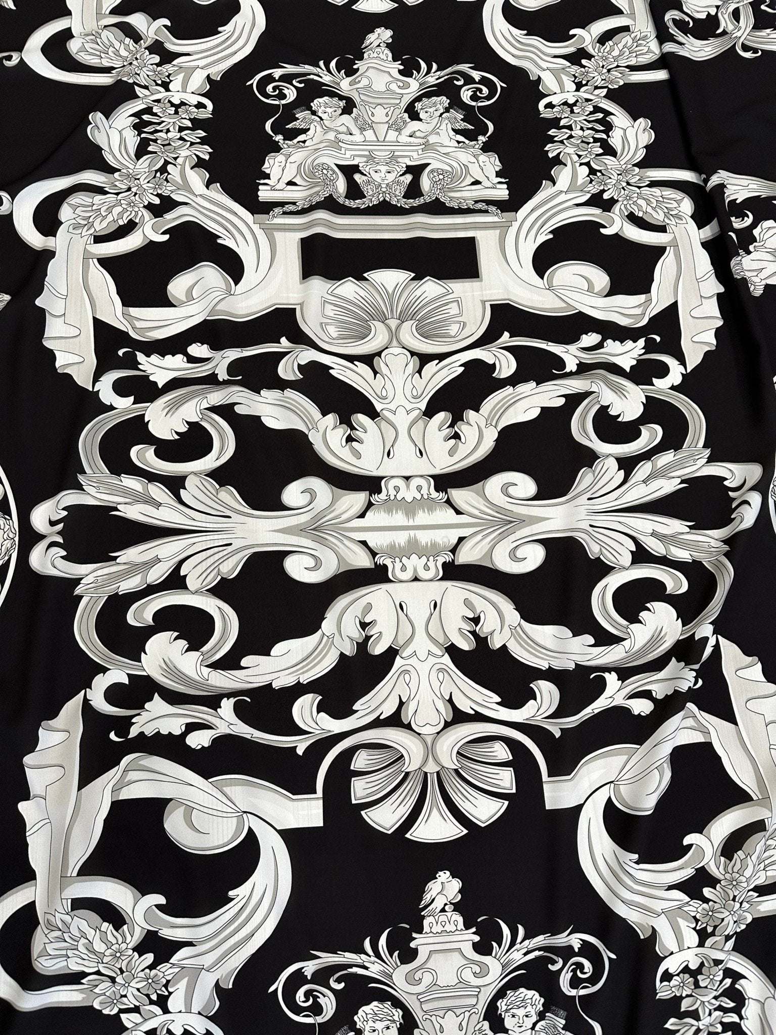 Luxurious silver baroque pattern on black fabric with intricate ornamental design
