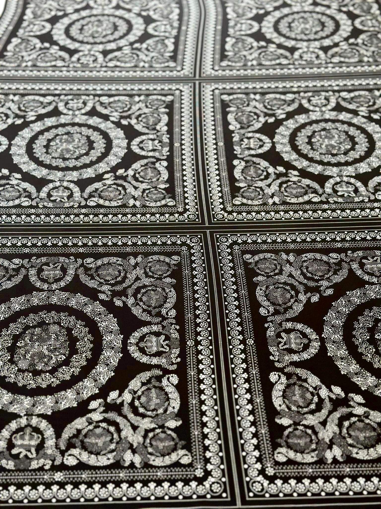 Baroque silver upholstery fabric with intricate decorative pattern in square panels on dark background