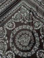 Baroque silver upholstery fabric with intricate floral and circular Baroque pattern on dark background
