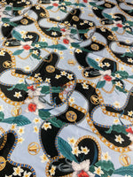 Sky blue fabric with floral and gold chain print for fashion and décor