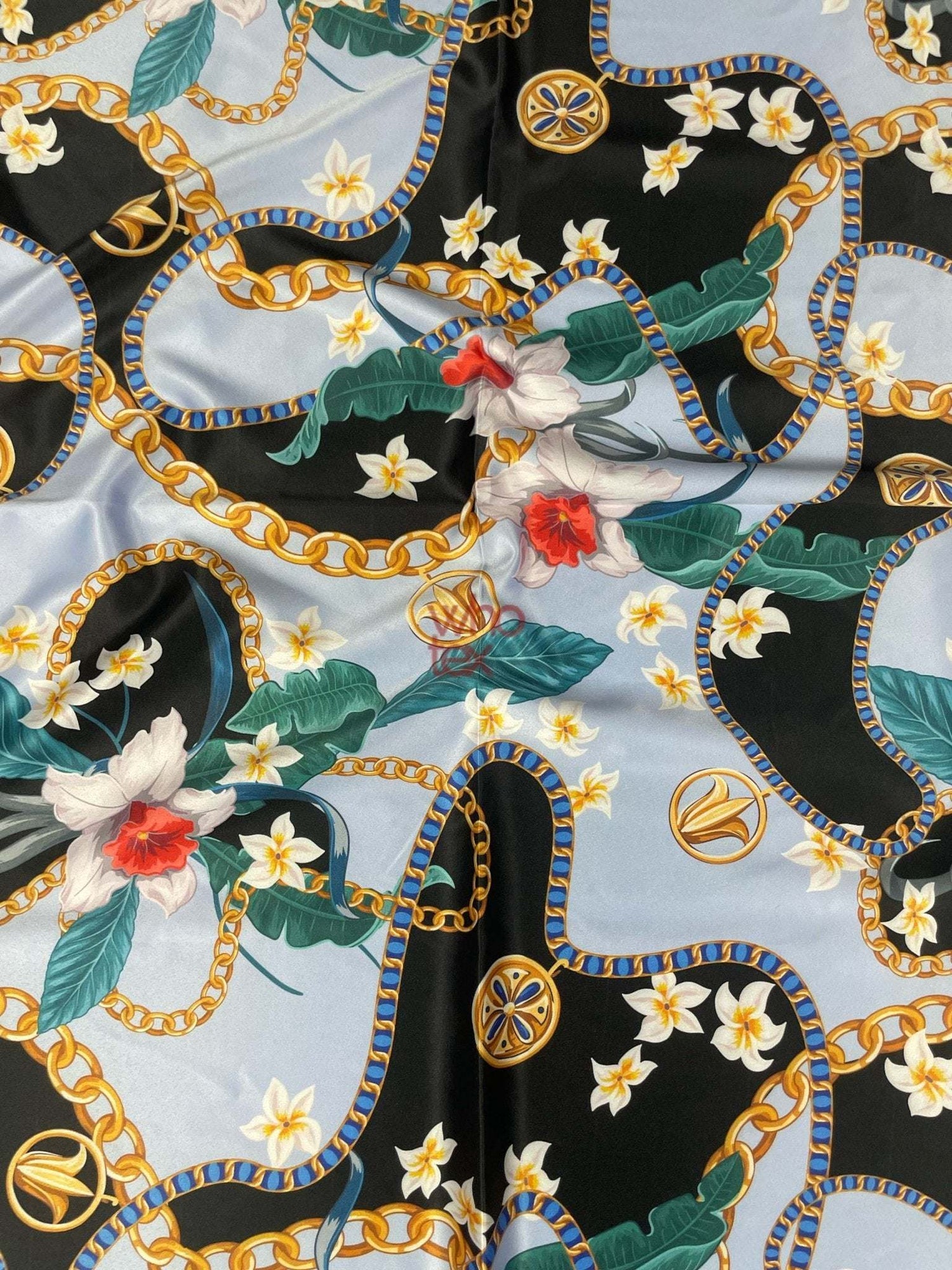 Sky blue fabric with floral and gold chain print, 150cm wide, suitable for fashion and home décor projects