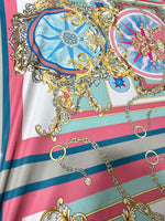 Baroque chain pattern fabric with ornate gold and pastel blue design on striped background