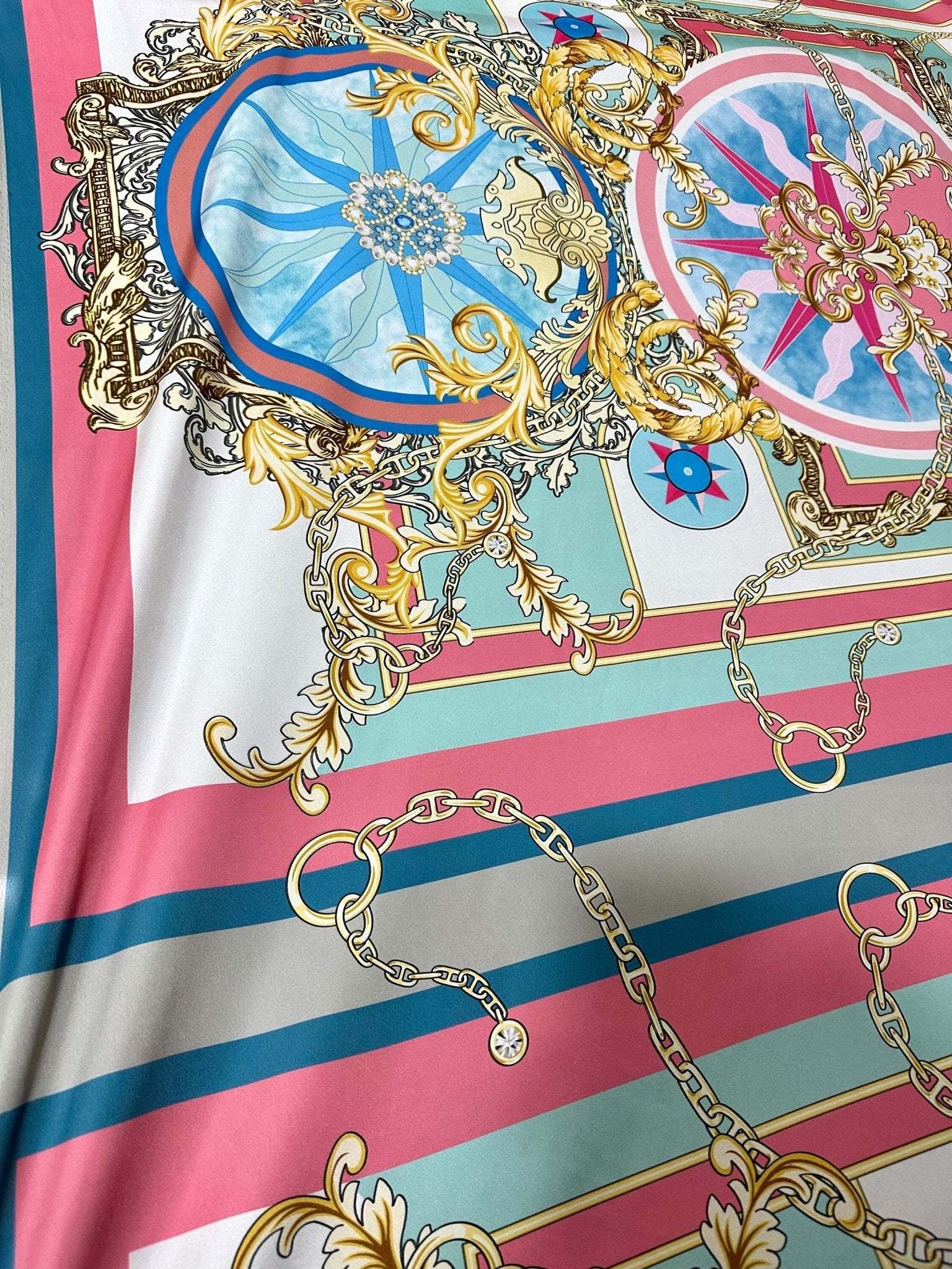 Baroque chain pattern fabric with ornate gold and pastel blue design on striped background
