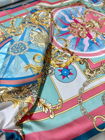 Baroque chain pattern fabric with ornate gold scrolls, chains, and pastel blue and pink background design