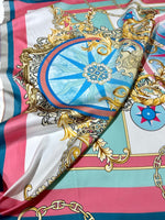 Baroque Chain Pattern Fabric with ornate gold chains, blue compass motif, and pink, teal, and white background detail