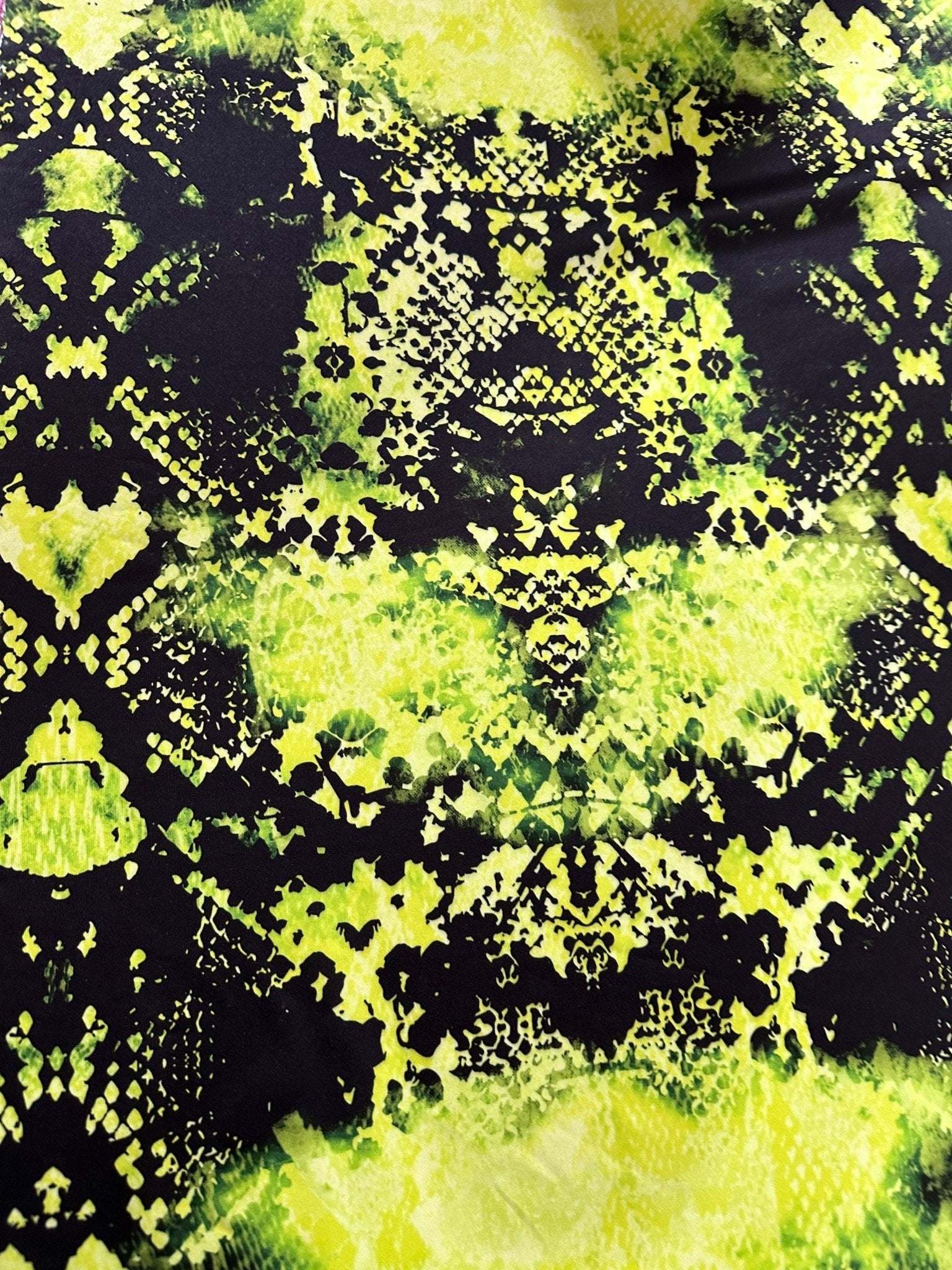 neon green spandex fabric with black abstract pattern, stretchy and vibrant material for activewear and fashion projects