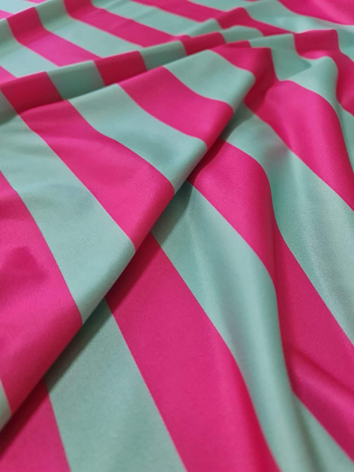 Mint green and pink striped fabric with bold, wide stripes and smooth texture for sewing and crafting projects