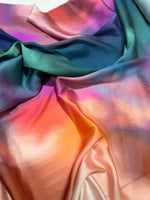 Rainbow multicolor satin fabric with smooth, vibrant gradient colors and a glossy finish ideal for sewing and crafting projects