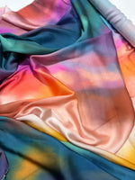 Rainbow multicolor satin fabric with smooth, vibrant, and glossy finish ideal for sewing and crafting projects