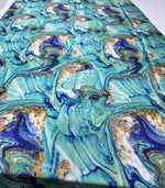 Turquoise and blue marble print fabric with gold accents and 150cm width for crafting and home decor projects