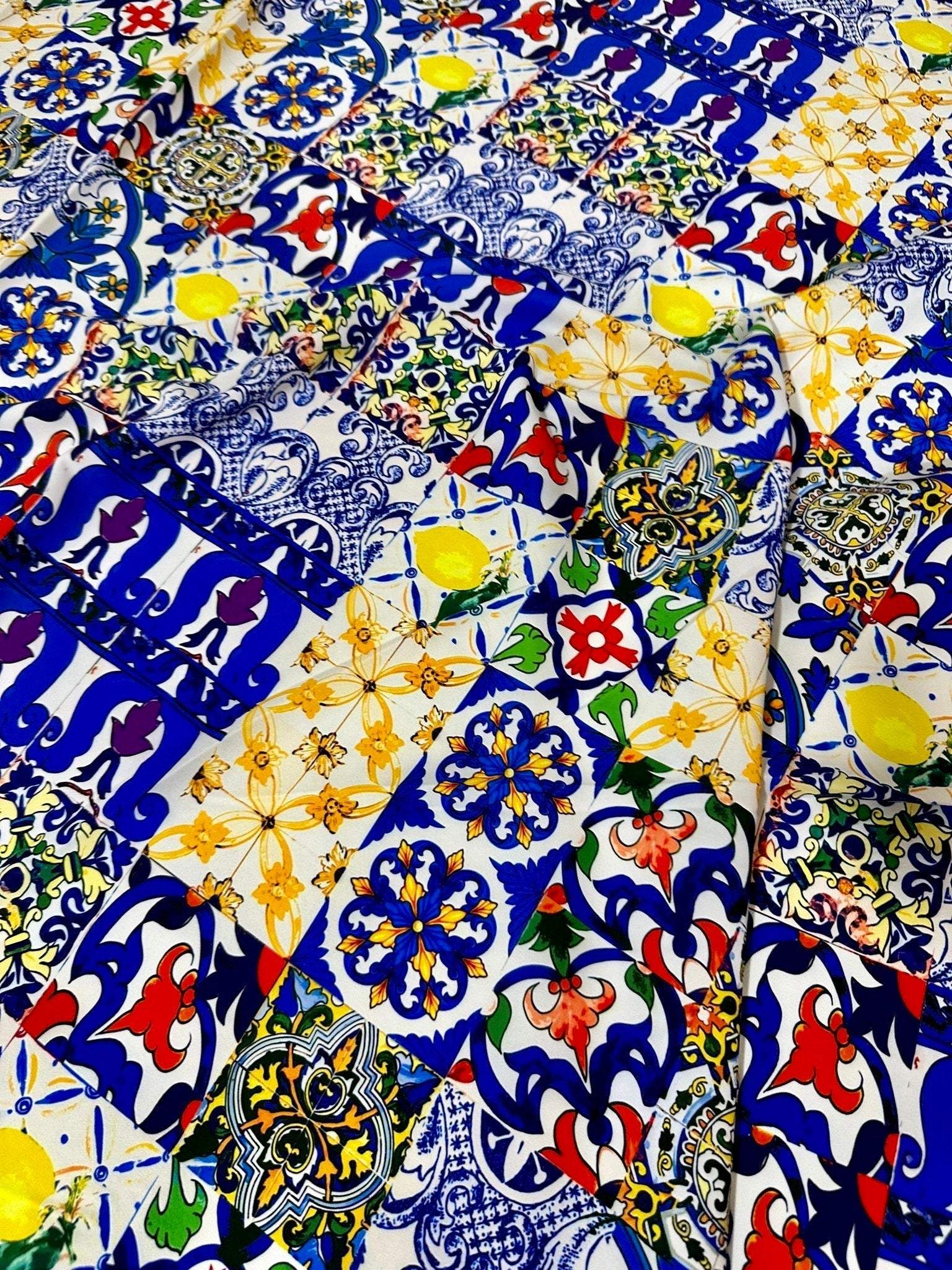 colorful tile pattern fabric with blue, yellow, and red intricate designs for sewing and crafting projects