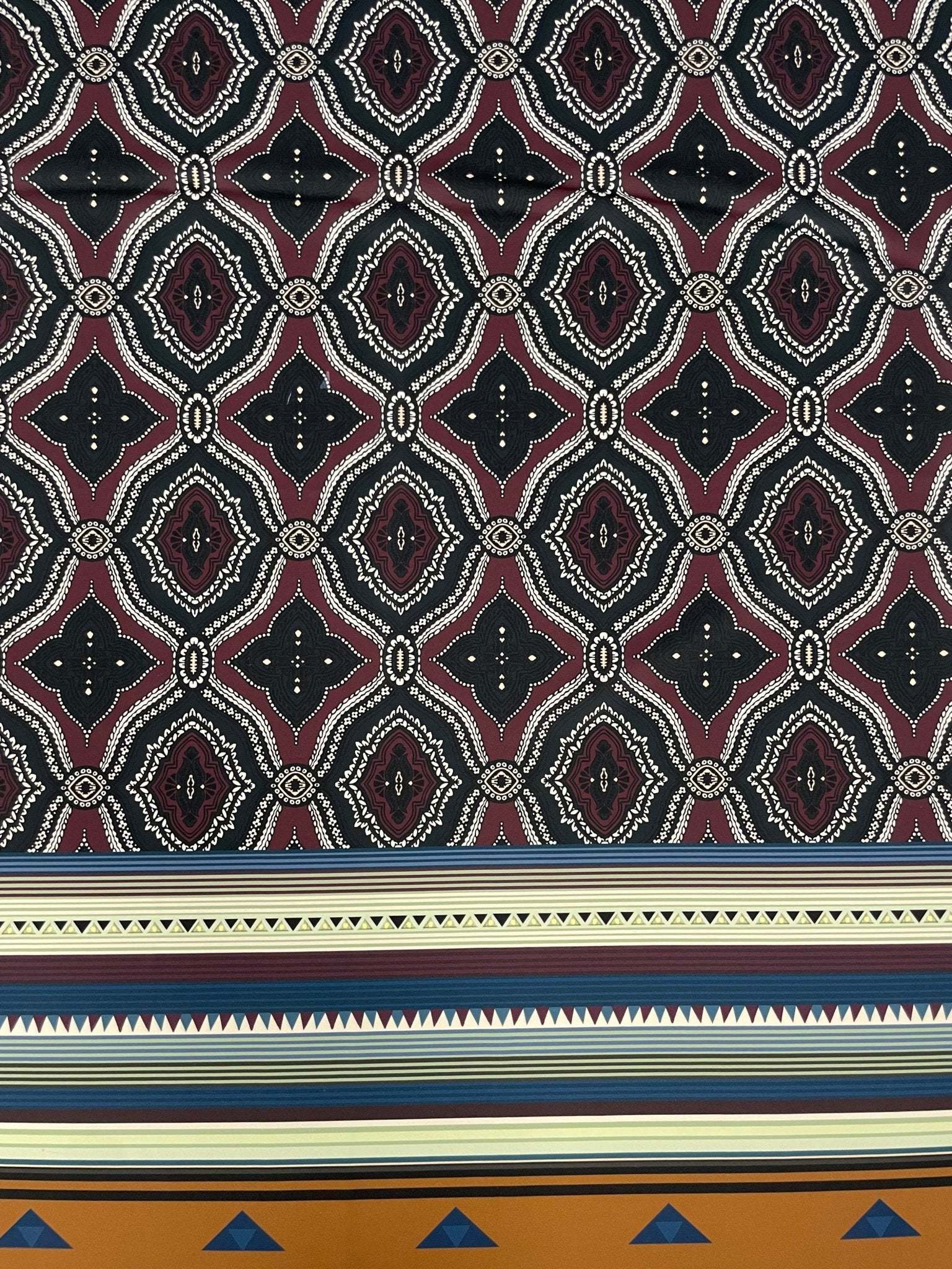 Burgundy and black geometric tribal fabric with ethnic striped border design
