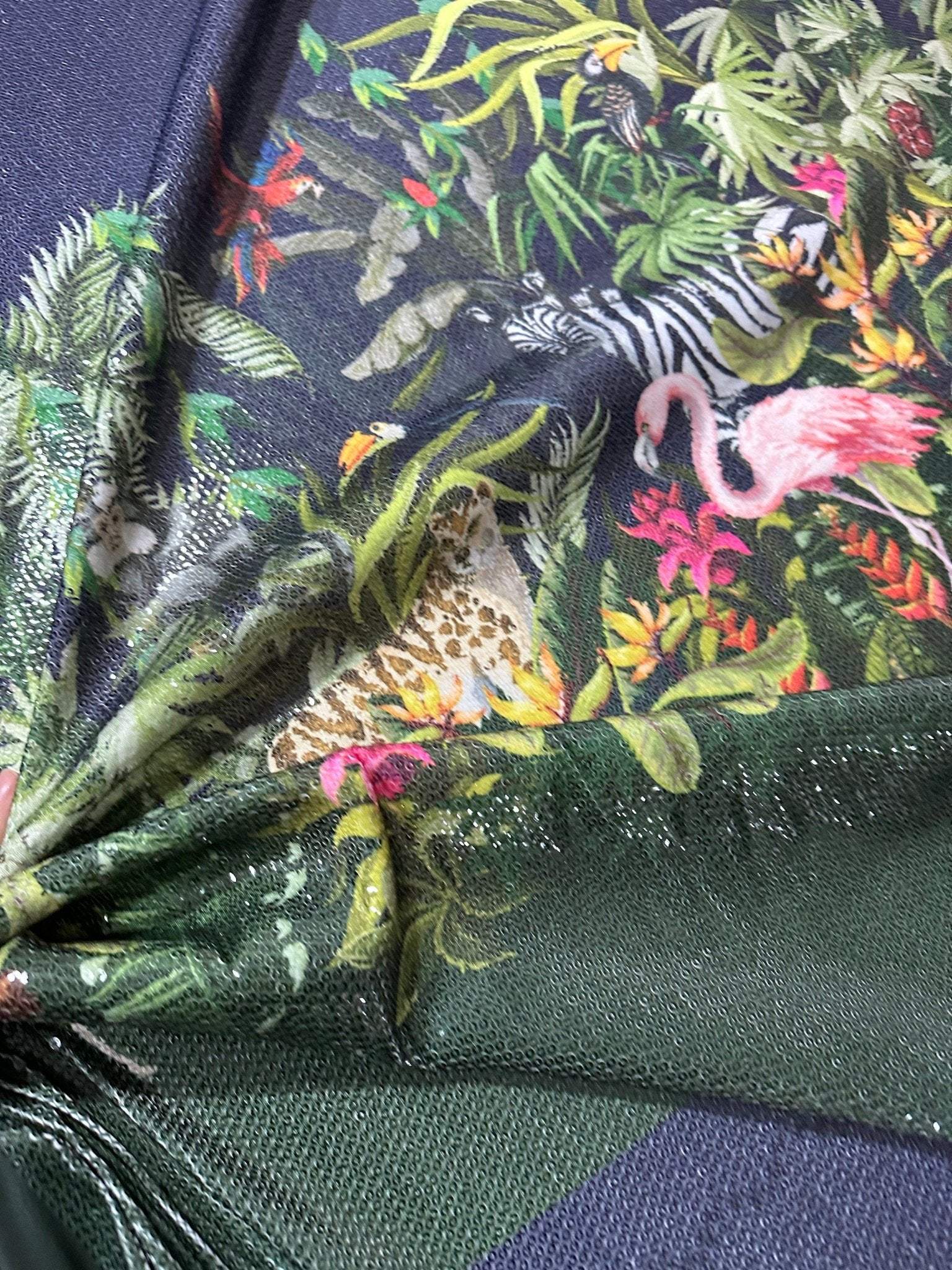 Tropical jungle print fabric with vibrant animals and foliage, 2-way stretch, ideal for fashion projects