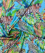 Bright tropical and leopard pattern fabric bundle with vibrant leaves and big cats on blue background