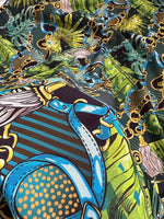 Tropical fabric with vibrant chain belt pattern in bold colors and intricate design