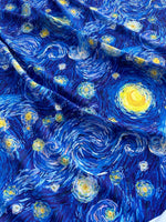 Blue fabric featuring a vibrant Van Gogh starry night inspired swirling pattern for crafting and quilting