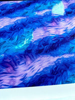 Abstract blue and purple tie dye pattern fabric with vibrant swirling design and soft texture