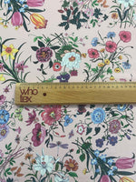 Vintage botanical floral print fabric with colorful flowers on cream background and wooden ruler for scale