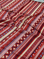 Vintage ethnic pattern shimmer lurex fabric with 4-way stretch in red and purple tones, ideal for sportswear, activewear, and costumes.
