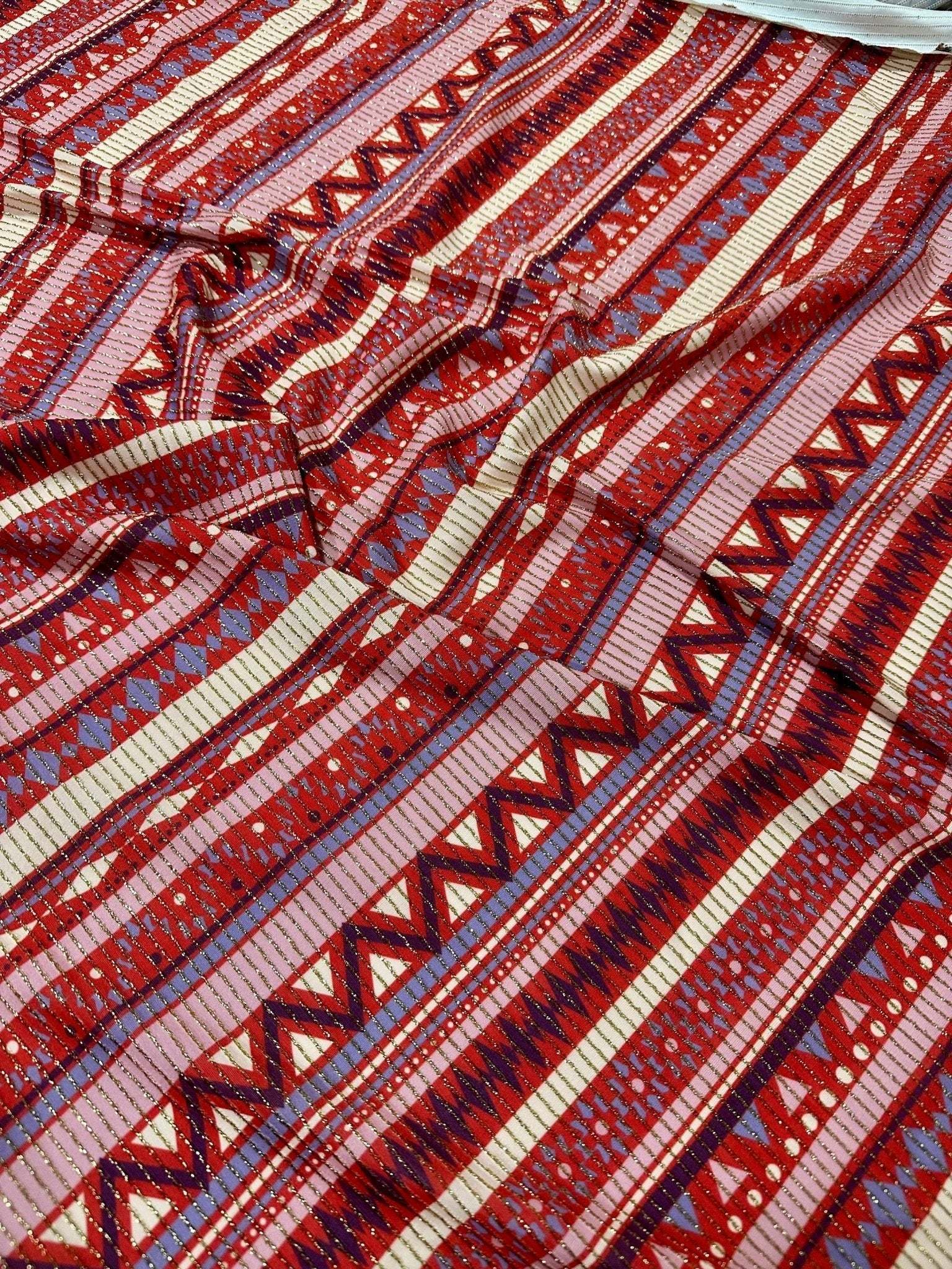 Vintage ethnic pattern shimmer lurex fabric with 4-way stretch in red and purple tones, ideal for sportswear, activewear, and costumes.
