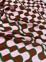 Vintage fabric with pink and brown wavy pattern inspired by 60s and 70s retro style